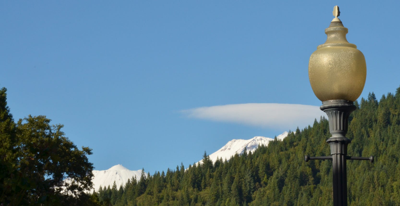 Mt. Shasta and a lenticular can barely be seen over the ridge in this photo taken from Dunsmuir.