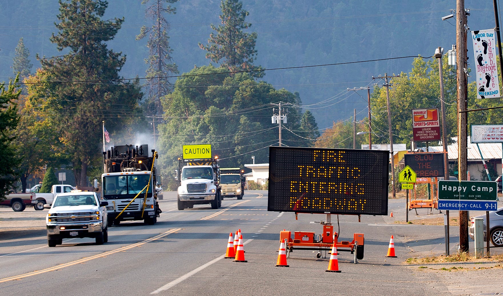Road signs on Highway 96 warn travelers of fire traffic in Happy Camp, California.
