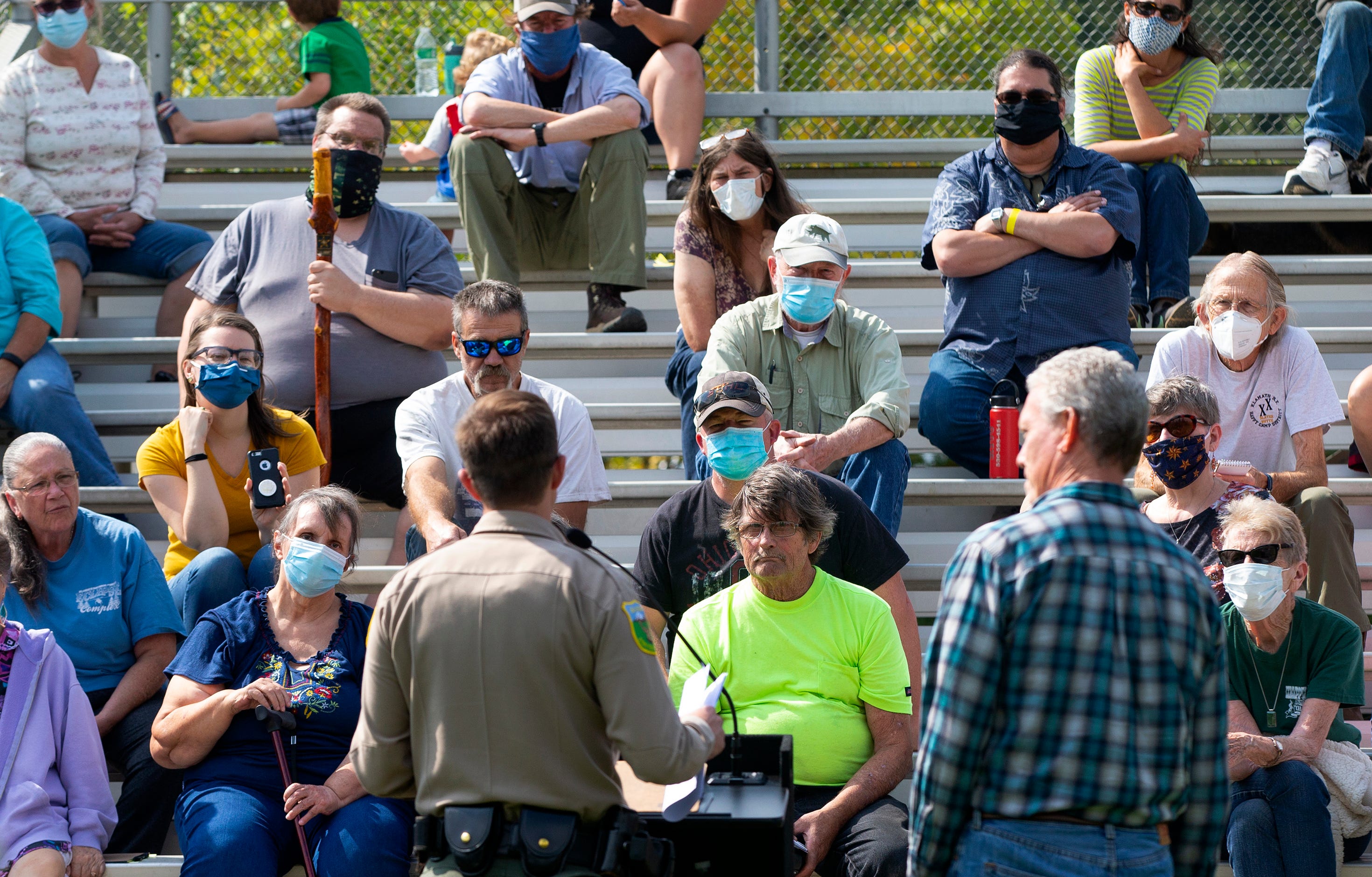 Members of the Happy Camp community listen to a fire update at Happy Camp High School. The Slater Fire stormed through their town, destroying about 160 homes.